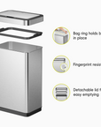 EKO Trash Can displayed with its components. Feature text highlights: "Bag ring holds bag in place," "Fingerprint resistant," and "Detachable lid for easy emptying."