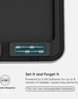 A close-up of an EKO trash can lid highlights battery slots. Text reads: "Set It and Forget It. Powered by 4 AA batteries for up to 8 months of reliable, hassle-free performance *Do not use rechargeable batteries*."