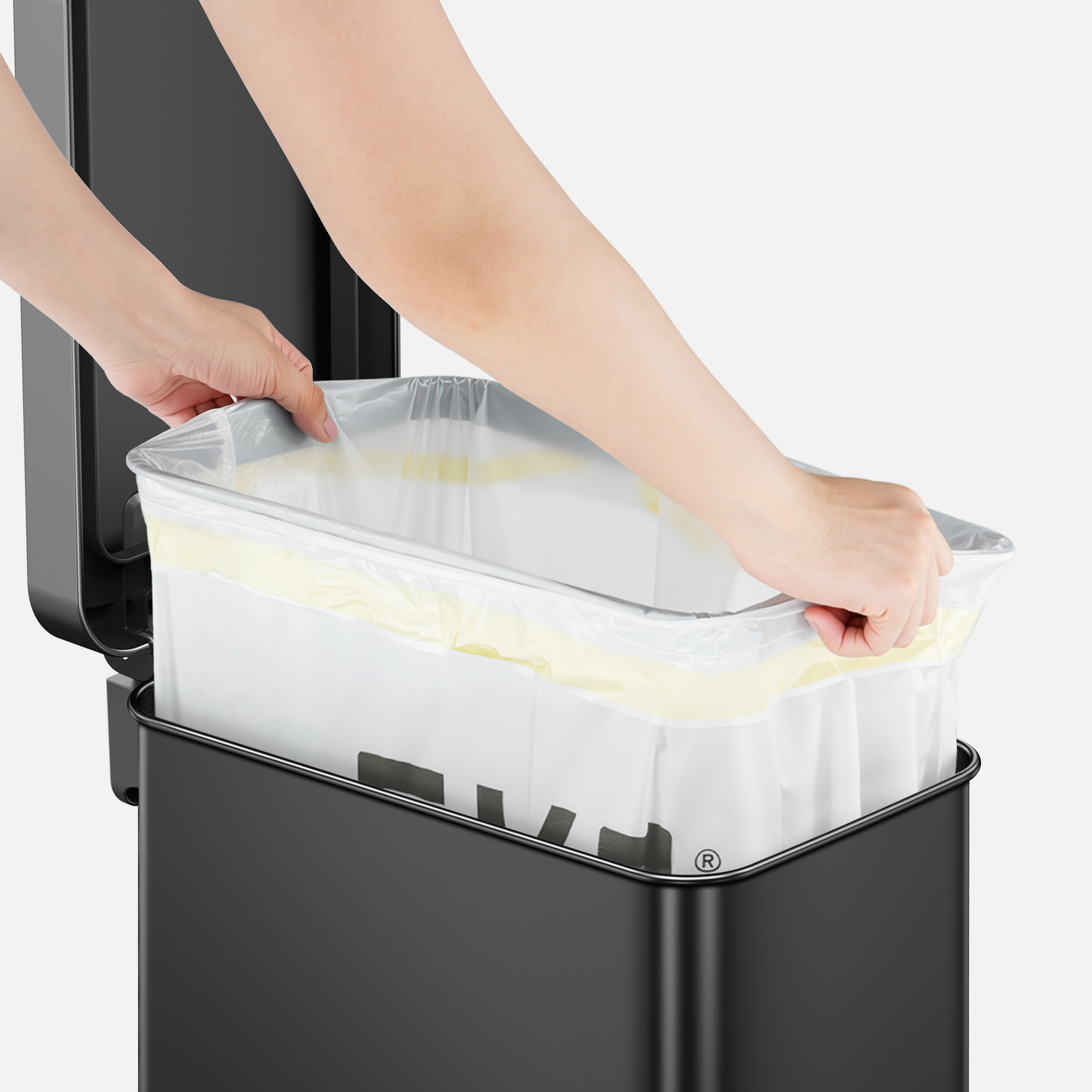 Change the Bag in Seconds - Step 2 - Lift up the liner ring and secure the trash bag around the ring.