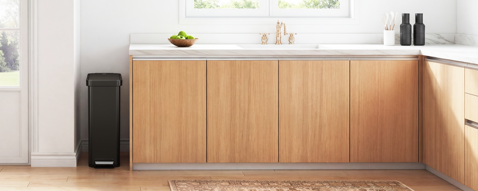 Modern kitchen with a slim EKO trash can.