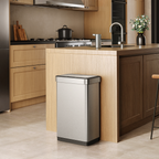 EKO Trash Can next to a modern kitchen counter, surrounded by light wood cabinetry and appliances.