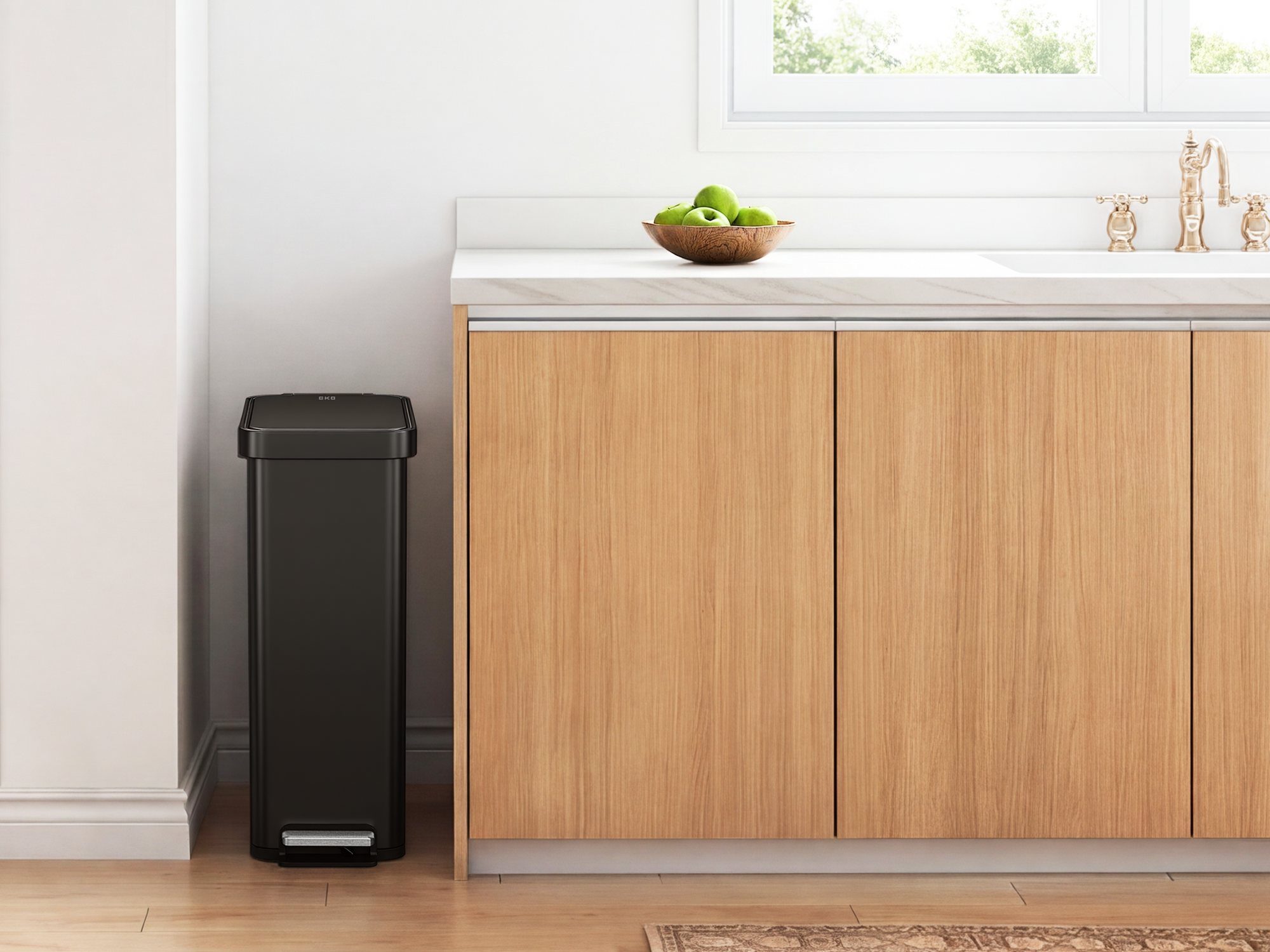 Modern kitchen with a slim EKO trash can.