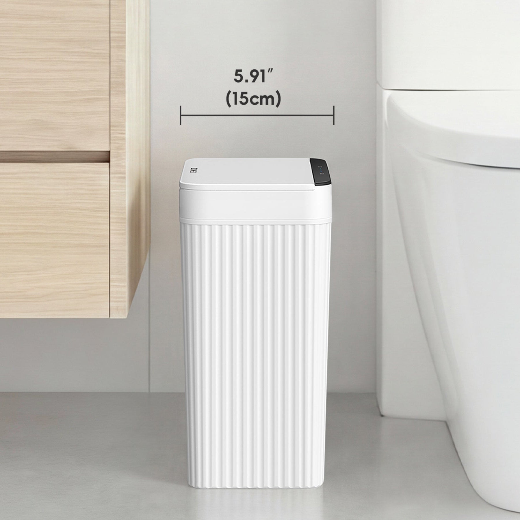 White trash bin with dimensions labeled in a bathroom setting