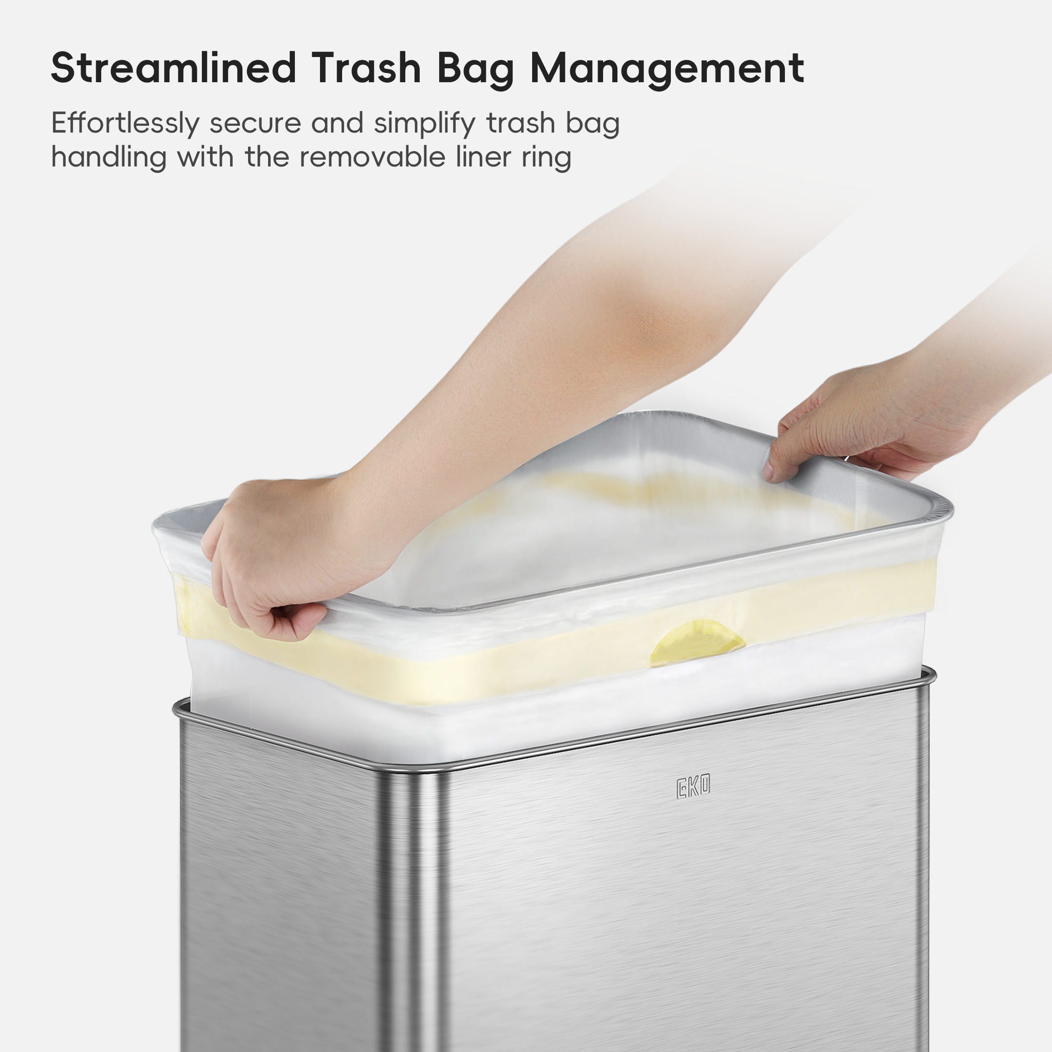 EKO trash bin with a transparent liner being removed by a hand, labeled 'Streamlined Trash Bag Management'.