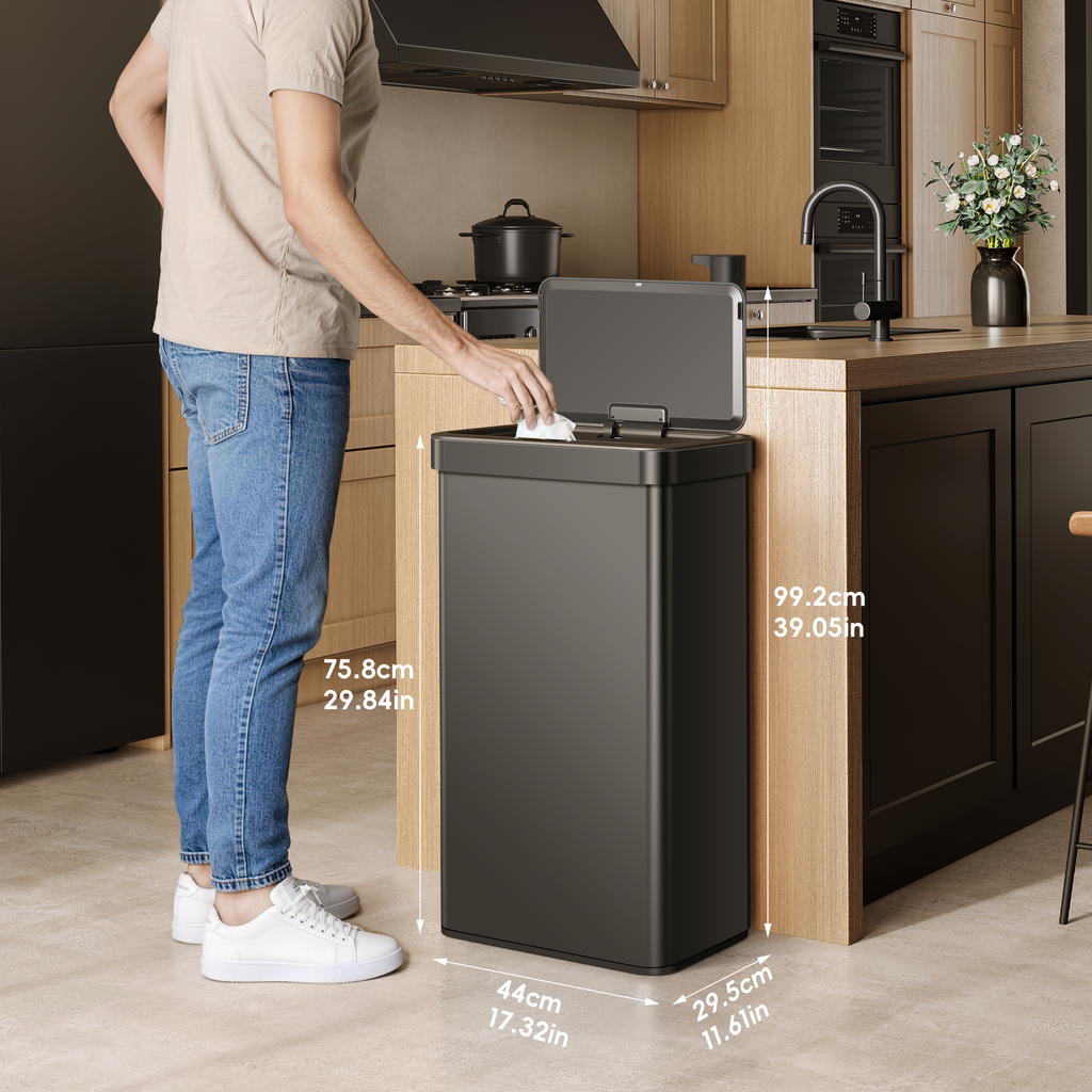 Person in a modern kitchen using an EKO  trash bin with dimensions labeled.
