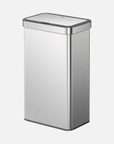 A modern, sleek EKO waste bin, constructed of brushed stainless steel, stands upright with its lid closed against a plain, light-colored background.