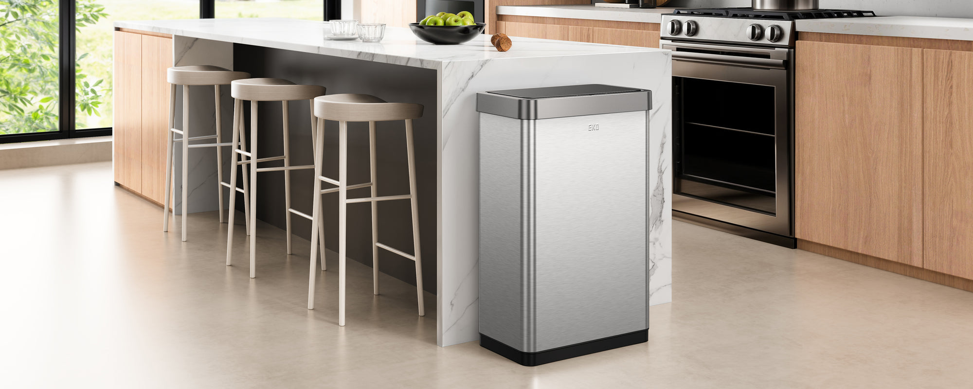 Modern kitchen with an EKO trash can in the foreground.