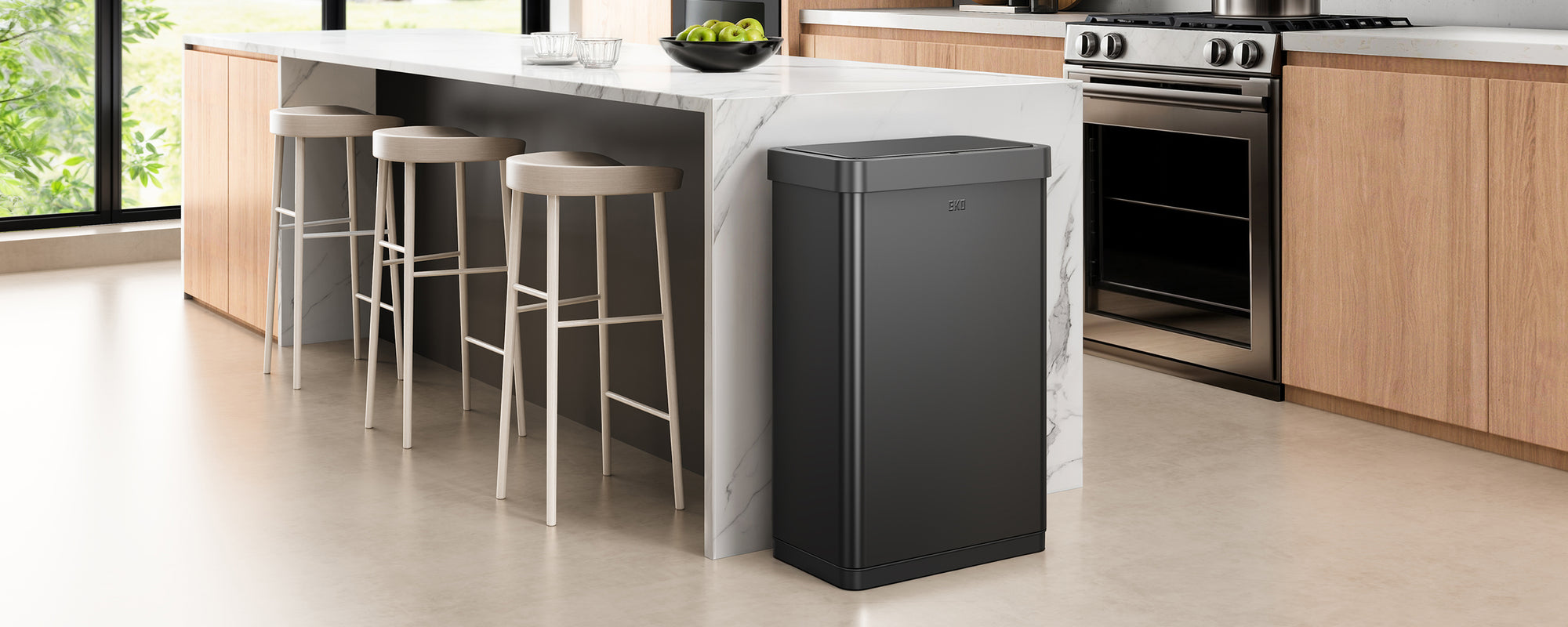 Modern kitchen with an EKO Trash Can in the foreground.