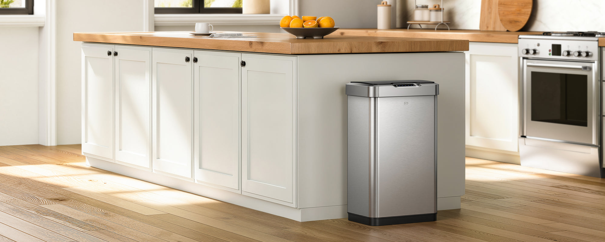 Modern kitchen with an EKO trash can in the foreground.